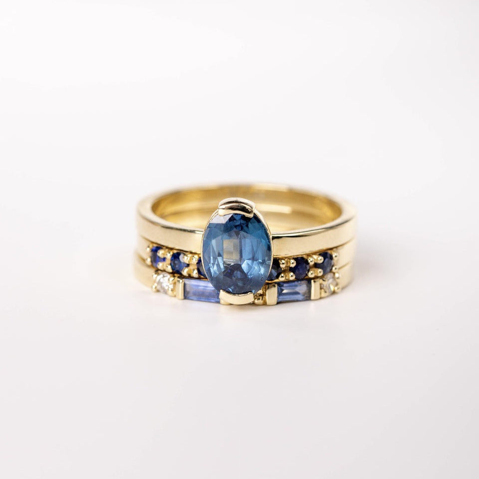 Anillo trío de oro con topacio azul
