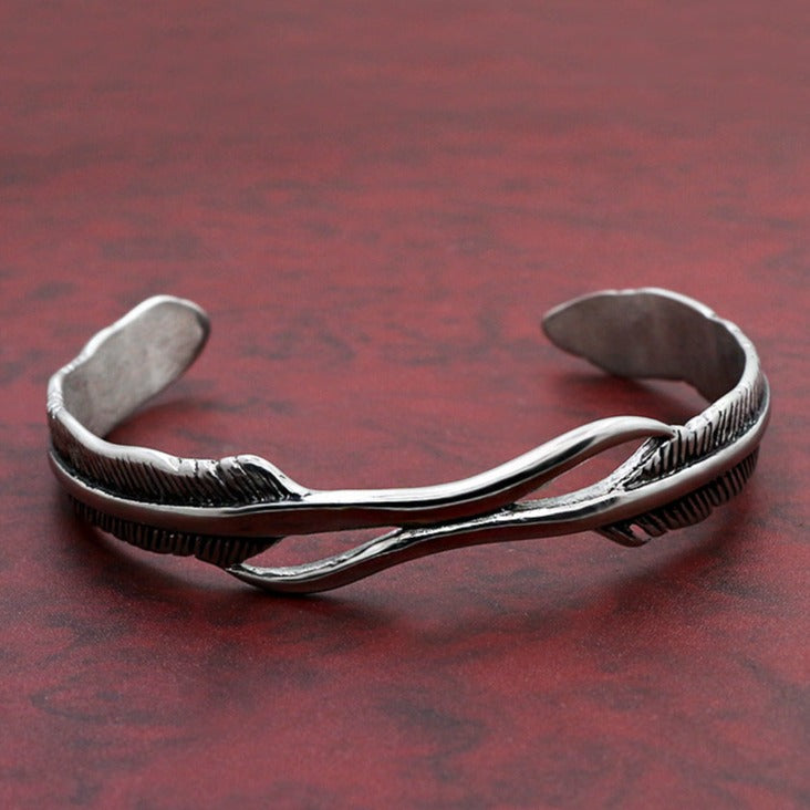 Pulsera de plumas en acero de titanio