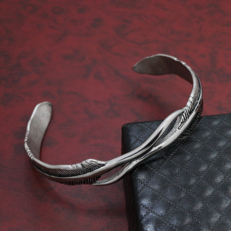 Pulsera de plumas en acero de titanio