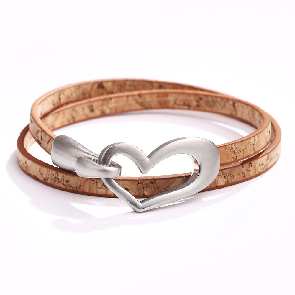 Bracelet or choker with heart motif.
