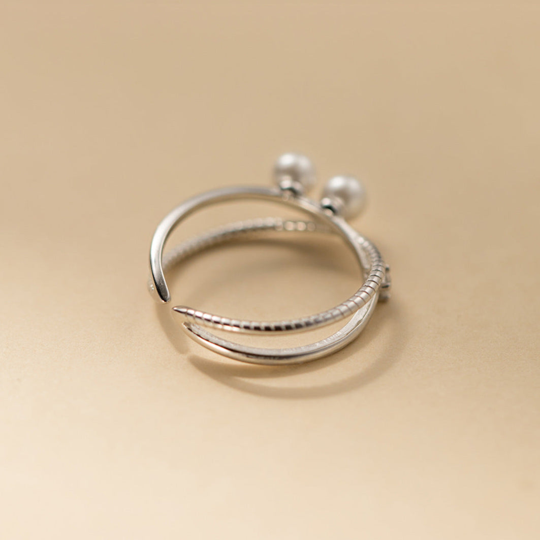 Anillo cruzado con perla