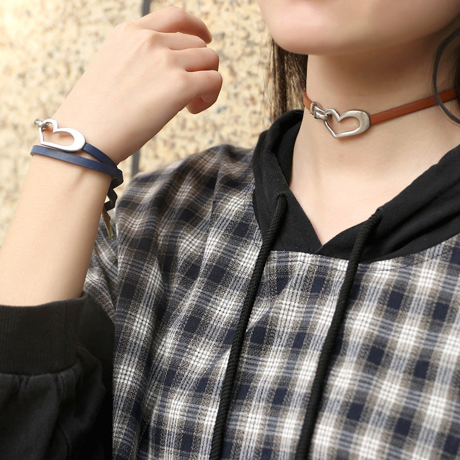 Bracelet or choker with heart motif.